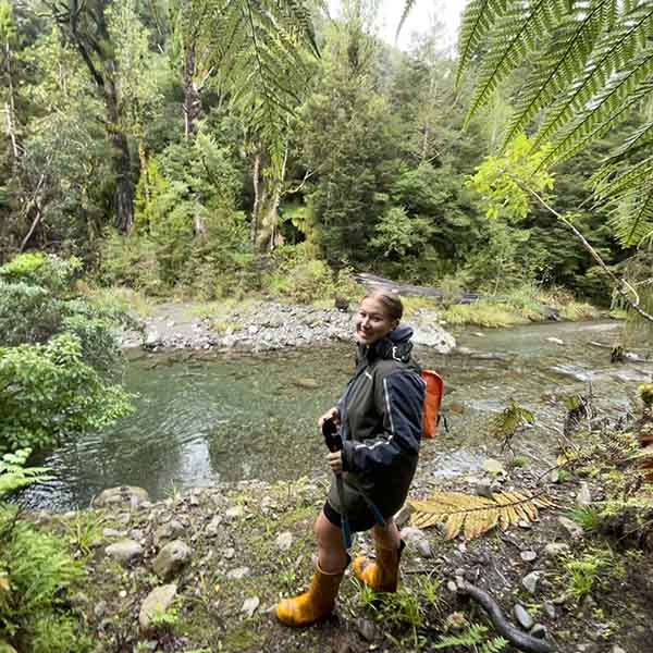 Photo of Ariana Ngaronoa at a freshwater stream